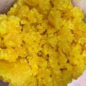 Macro close-up of premium Crumble live resin for sale with golden crystalline texture